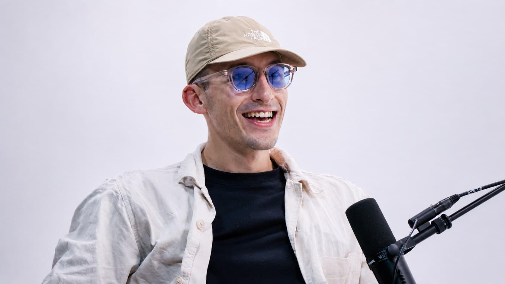 Solo podcast host — white cyc wall — VibeShack Studios SF